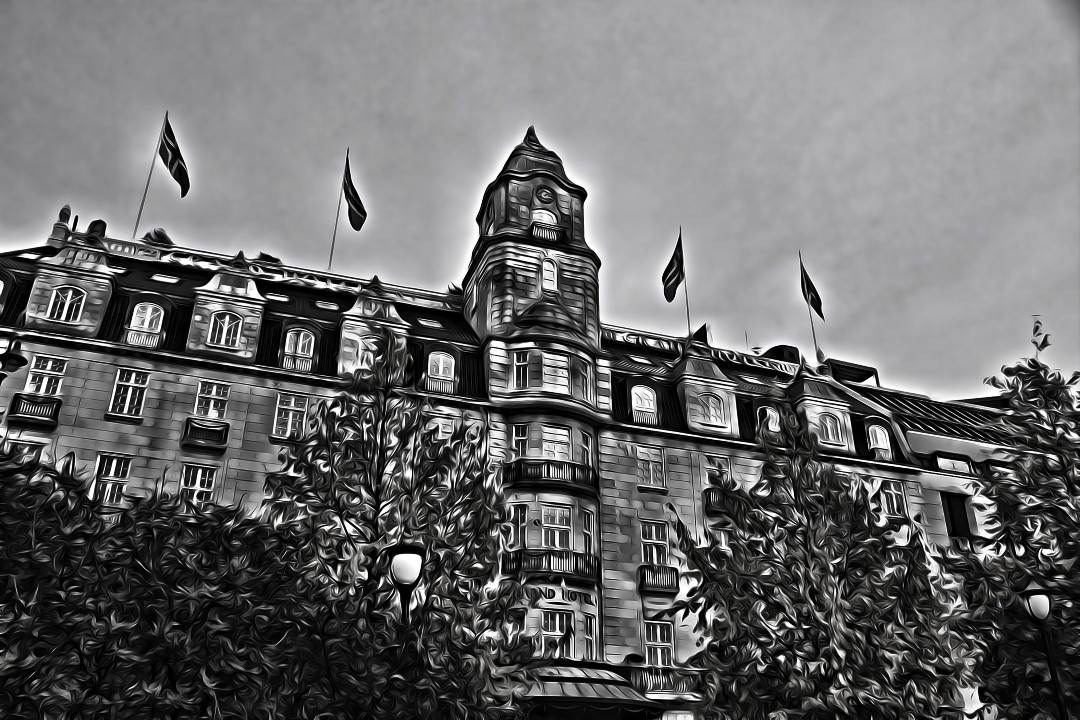 A black and white photo of Grand Hotel in Oslo with a painterly edit