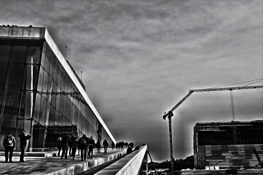 A black and white photo of the Oslo Opera House with a painterly edit